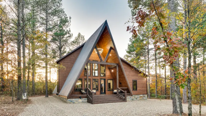 Modern A-frame cabin in forest setting